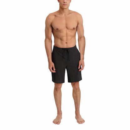 Front view of the navy Kirkland Signature Men's Swim Short laid flat showing the flat waistband, rubber-tipped drawcord, and quick-dry recycled fabric texture.