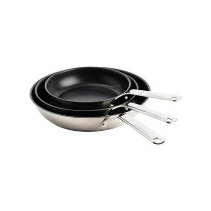 Close-up of the KitchenAid stainless steel pan featuring the ceramic non-stick surface and induction base.