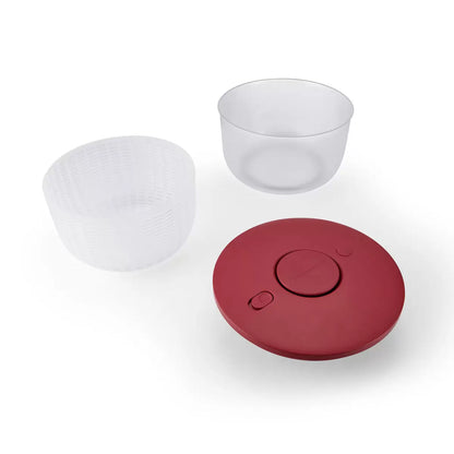 KitchenAid Salad Spinner in red and black available, demonstrating the pump-action drying mechanism on a clean kitchen countertop.
