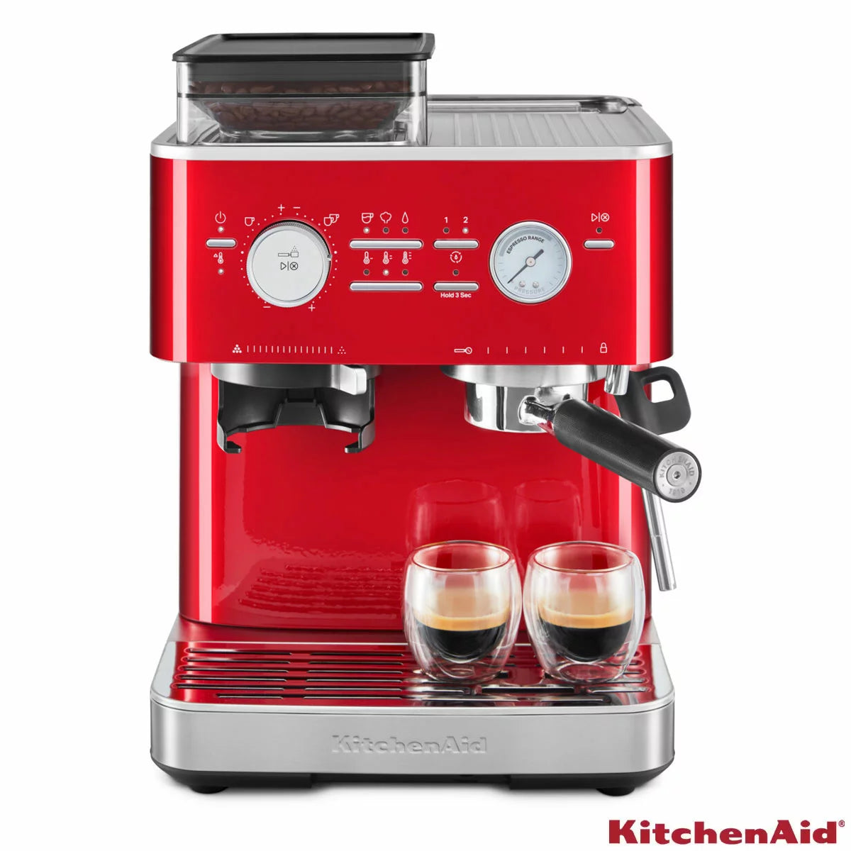 KitchenAid Candy Apple red semi automatic espresso machine with built in burr grinder, 58mm portafilter, and stainless steel milk pitcher on a clean kitchen countertop.