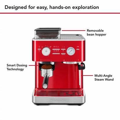 KitchenAid Candy Apple red semi automatic espresso machine with built in burr grinder, 58mm portafilter, and stainless steel milk pitcher on a clean kitchen countertop.