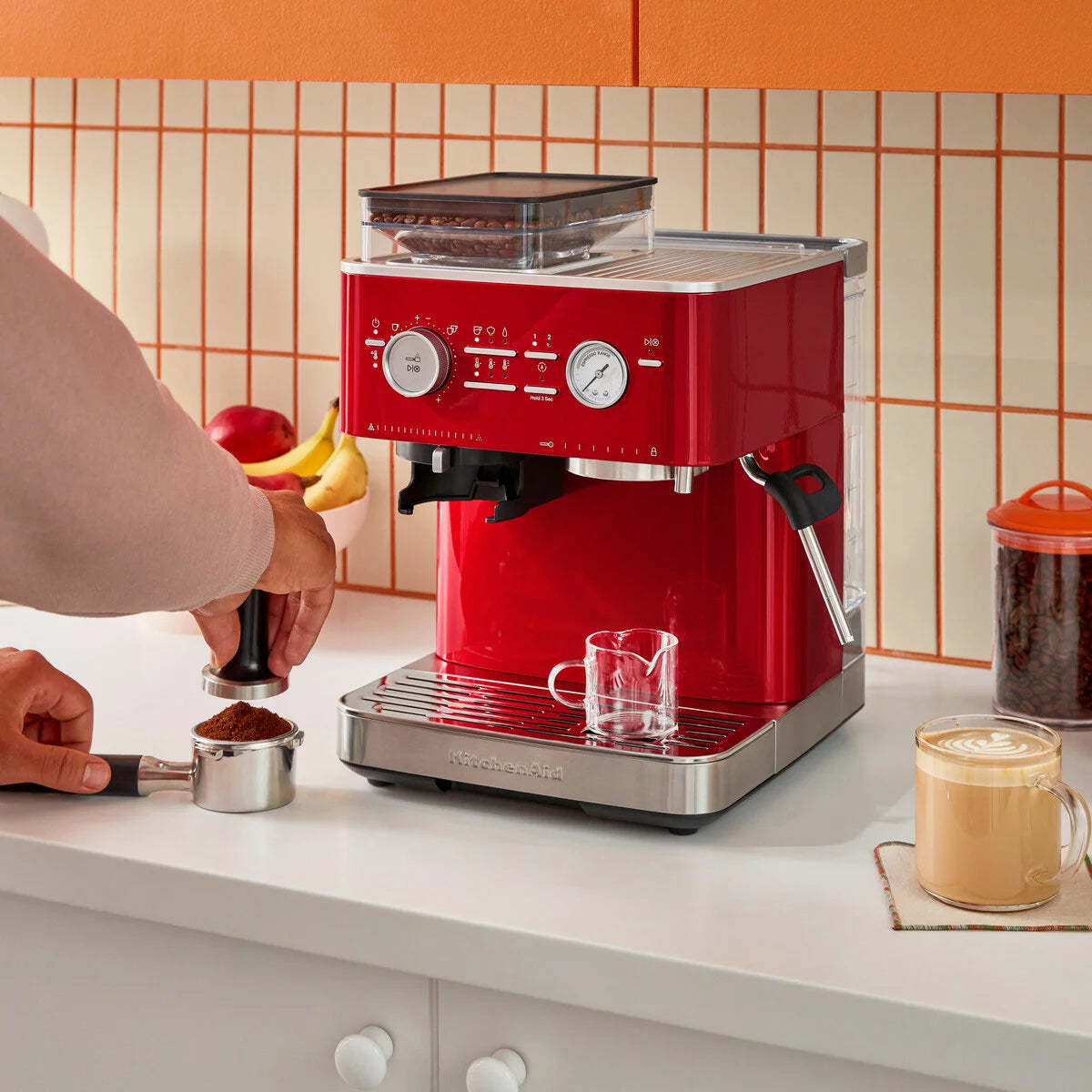 KitchenAid Semi Auto Espresso Machine 5KES6551BCA with integrated burr grinder brewing fresh espresso and milk-based coffee drinks.