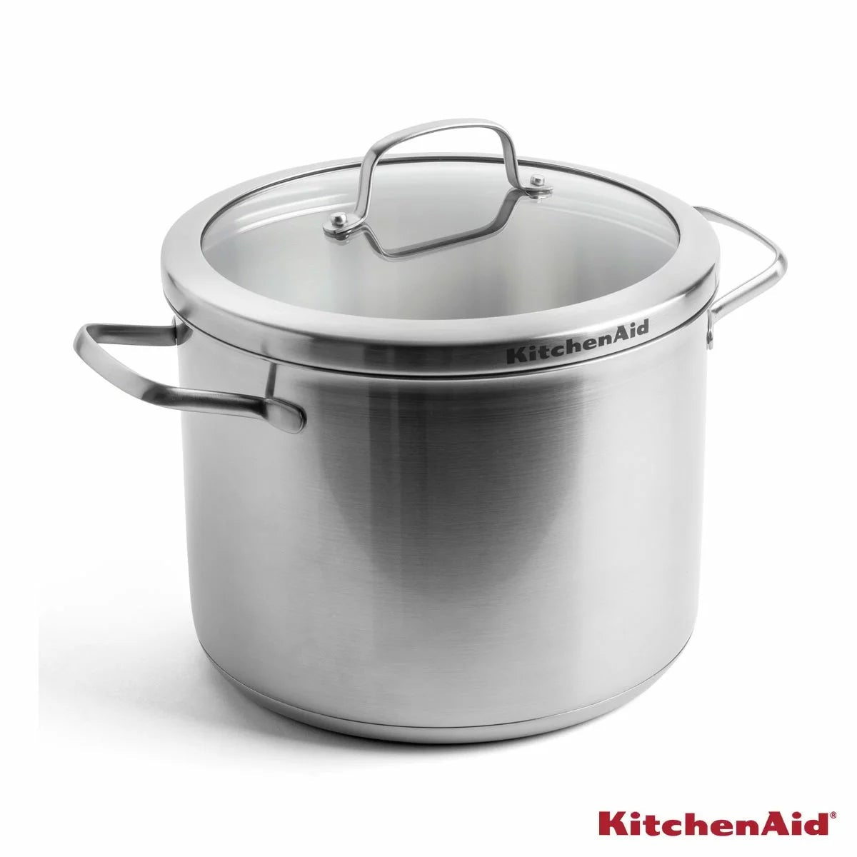 KitchenAid Proline 8-litre stainless steel stockpot with lid and welded steel handles shown on an induction stovetop.
