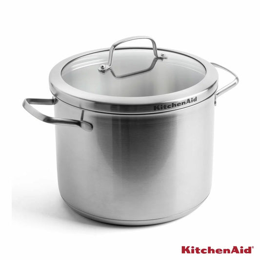 KitchenAid Proline 8-litre stainless steel stockpot with lid and welded steel handles shown on an induction stovetop.