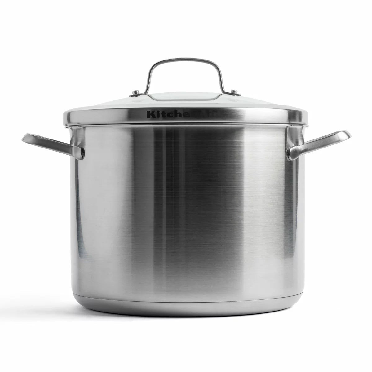 KitchenAid Proline 8-litre stainless steel stockpot with lid and welded steel handles shown on an induction stovetop.