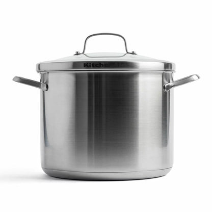 KitchenAid Proline 8-litre stainless steel stockpot with lid and welded steel handles shown on an induction stovetop.