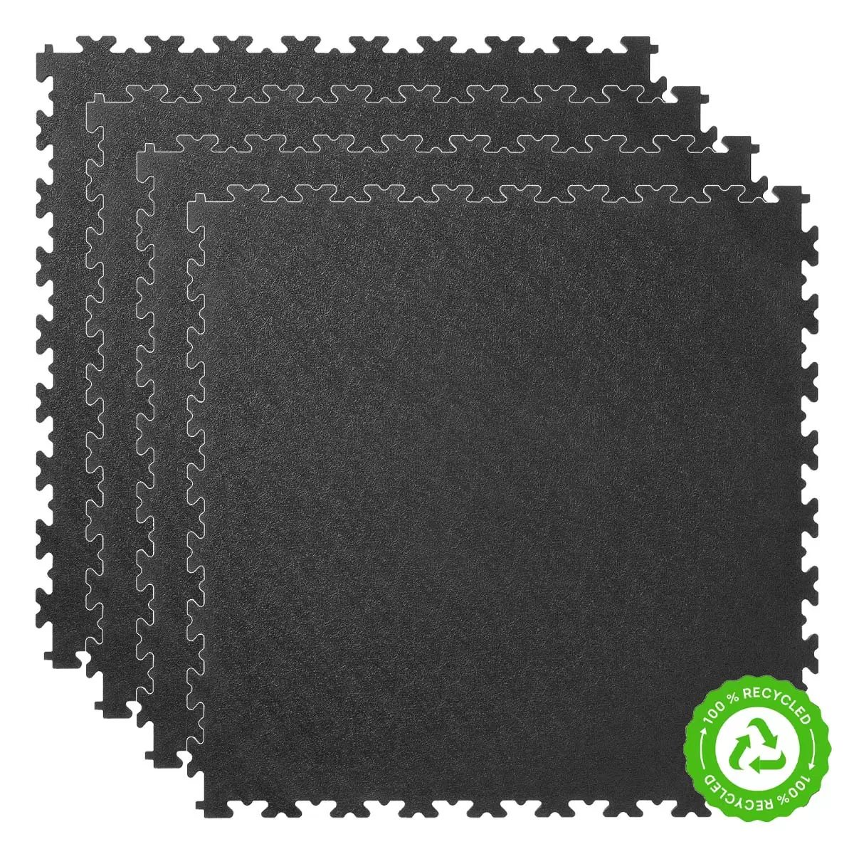 A close-up high-angle view of four interlocking Klikflor RX500 7mm black and graphite recycled garage tiles laid out on a workshop floor.