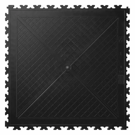 A close-up high-angle view of four interlocking Klikflor RX500 7mm black and graphite recycled garage tiles laid out on a workshop floor.