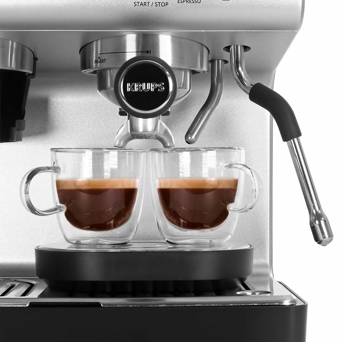 Krups XP801TG0 espresso coffee machine with grinder black and stainless steel making fresh barista-style coffee at home.