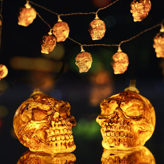 A 2-pack of 9.8ft Kyoffiie Halloween string lights featuring 20 LED bulbs glowing softly along a festive porch railing.