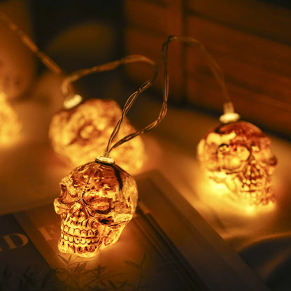 A 2-pack of 9.8ft Kyoffiie Halloween string lights featuring 20 LED bulbs glowing softly along a festive porch railing.