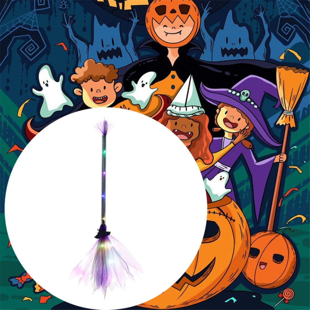 An adjustable light-up LED witch broom wrapped in gauze and ribbon glowing against a dark outdoor background.