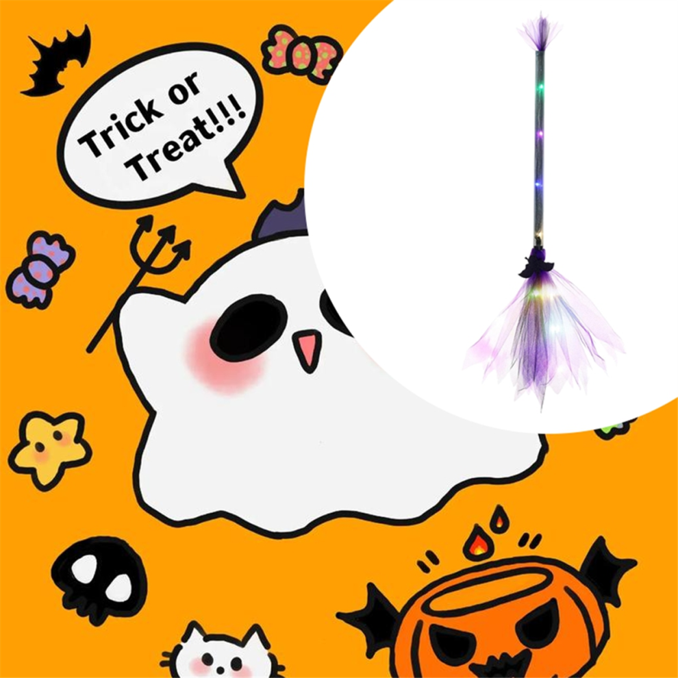 An adjustable light-up LED witch broom wrapped in gauze and ribbon glowing against a dark outdoor background.