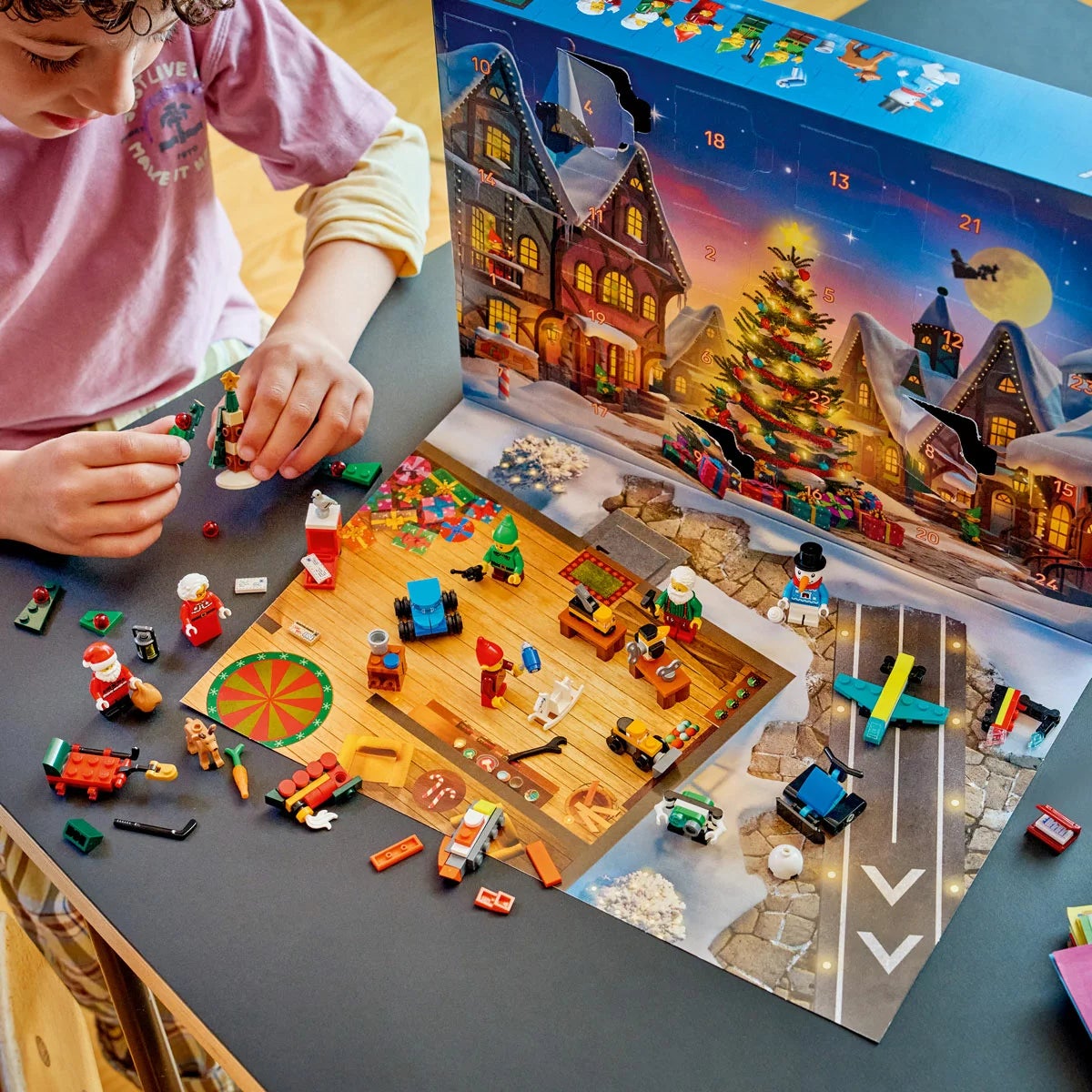 Front view of the unopened LEGO City Advent Calendar 2026 packaging box showing model number 60510 and colorful festive mini-build illustrations set against a bright holiday backdrop.