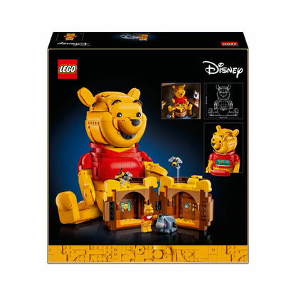 Three-quarter studio view of the built yellow LEGO 43300 Winnie the Pooh figure standing next to an open clay-colored honey pot revealing tiny interior rooms.