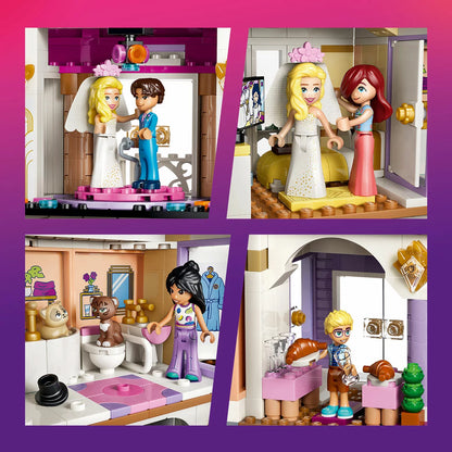Front view of the built colorful multi-story LEGO Friends 42704 Grand Hotel featuring a purple roof, transparent balconies, and minidolls standing outside.