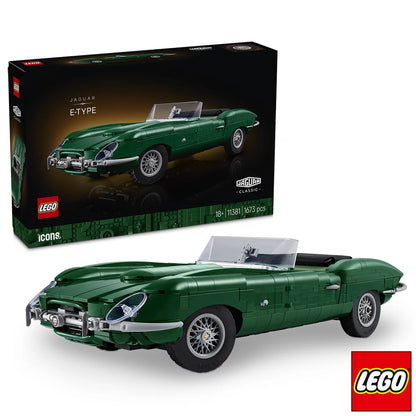 Three-quarter angle of built British green LEGO Icons Jaguar E-Type model car with wire-style wheels and dark interior on a dark wooden display surface.