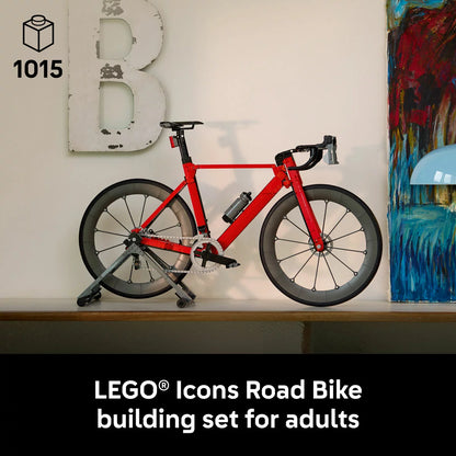 Three-quarter visual of the built LEGO Icons 11380 road racing bicycle model secured on its black paddock stand, showing the silver drive chain and rubber tires.