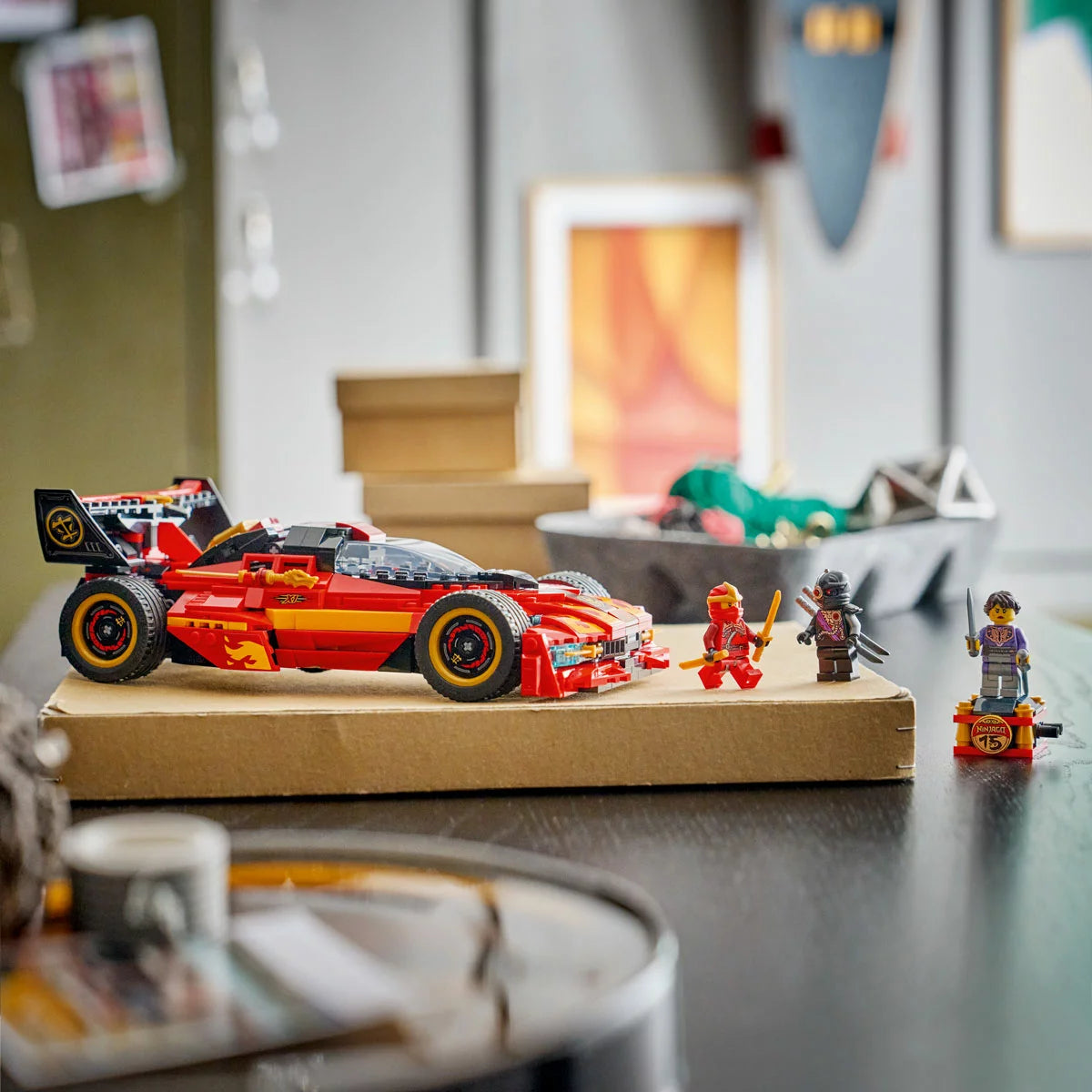 Three-quarter front angle of the LEGO Ninjago X-1 Ninja Charger red sports car with its hood lifted to show the concealed motorcycle inside, flanked by three minifigures on a plain surface.