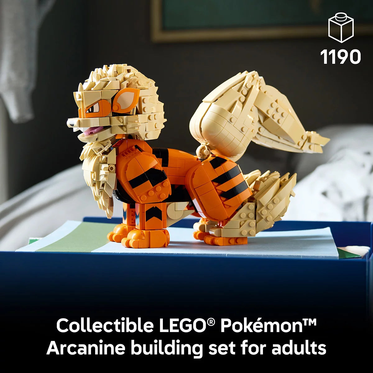 Front three-quarter view of the assembled orange and cream LEGO Pokémon Arcanine figure posed dynamically on a clean dark wood desk.