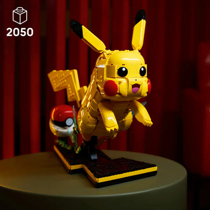Three-quarter studio view of the built yellow LEGO 72152 Pikachu leaping from an open red and white Poké Ball on a black display base showing the number 25.