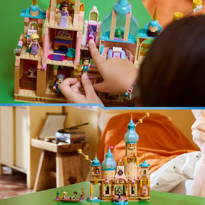 A colorful multi-level purple and beige LEGO Rapunzel's Castle featuring a high tower balcony, a blue brick-built rowboat, and miniature figures of Rapunzel and Flynn displayed on a clean play table.