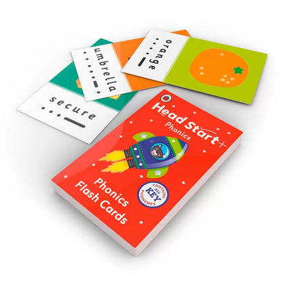 Flat lay view of the Ladybird Head Start 18 book and 52 flashcard set spread out on a white surface showing colorful phonics, maths, and handwriting covers.
