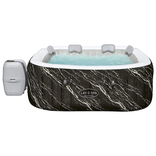 Lay-Z-Spa Florence 140 AirJet 6 person inflatable hot tub with illuminated outer pattern set up on a garden patio deck at twilight
