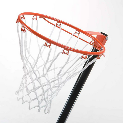 Black Lifetime portable netball goal with an orange rim set up on a paved driveway showing the adjustable steel pole and base.