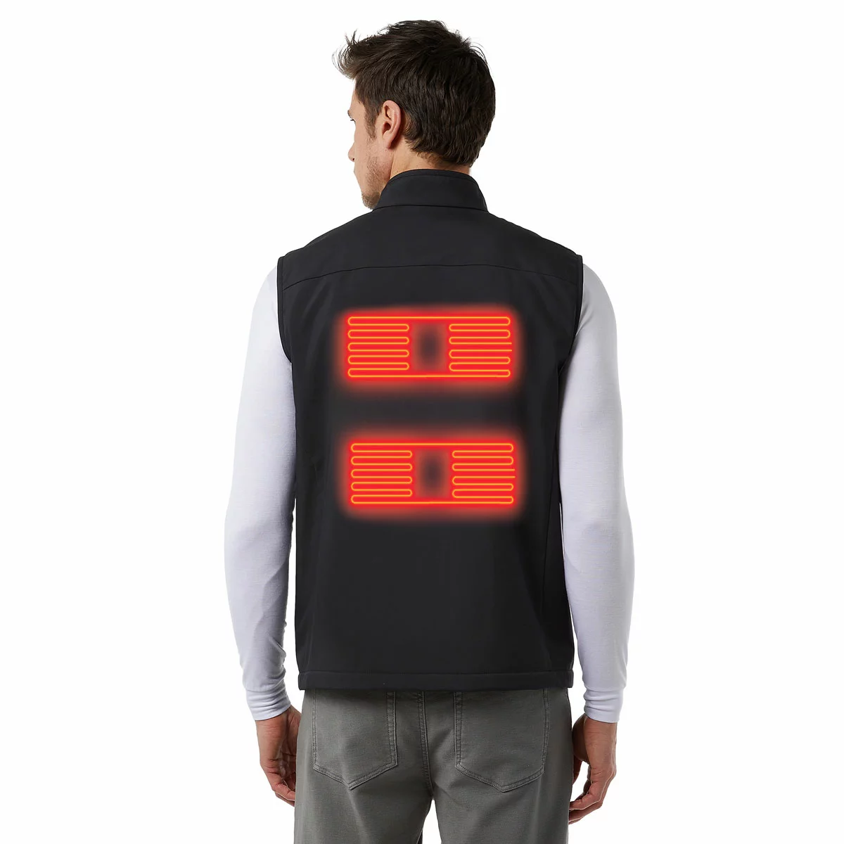 Black 32 Degrees heated vest laid flat displaying the glowing LED power button on the chest and the compact 10,000mAh battery pack resting nearby.