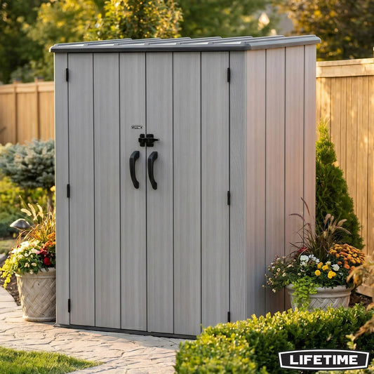 Lifetime 1510L vertical storage shed with dual doors open, showcasing adjustable interior shelving filled with garden tools on a concrete patio.