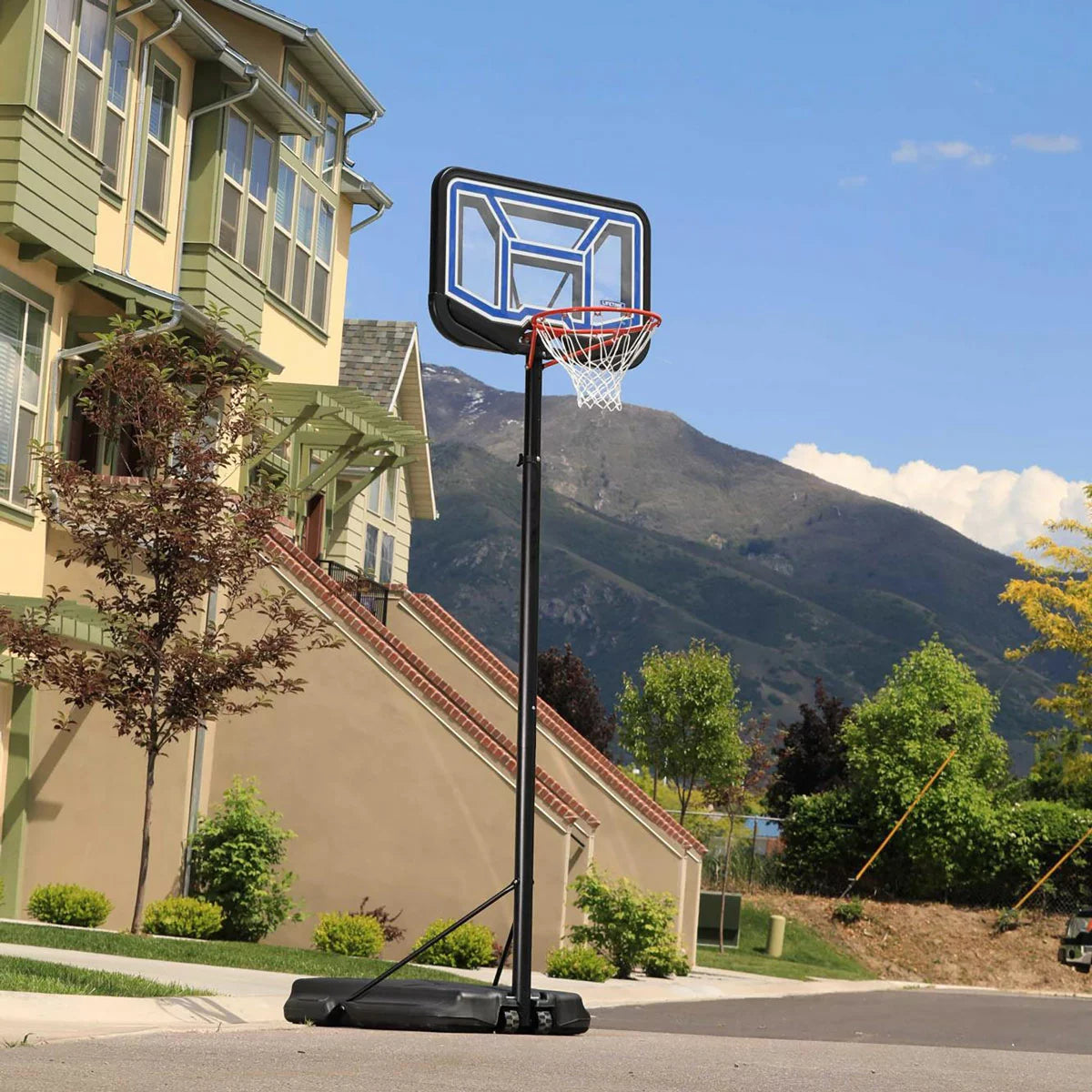 Lifetime 44 Inch Portable Basketball Hoop with adjustable height, durable backboard, and portable base for outdoor basketball practice and family games.