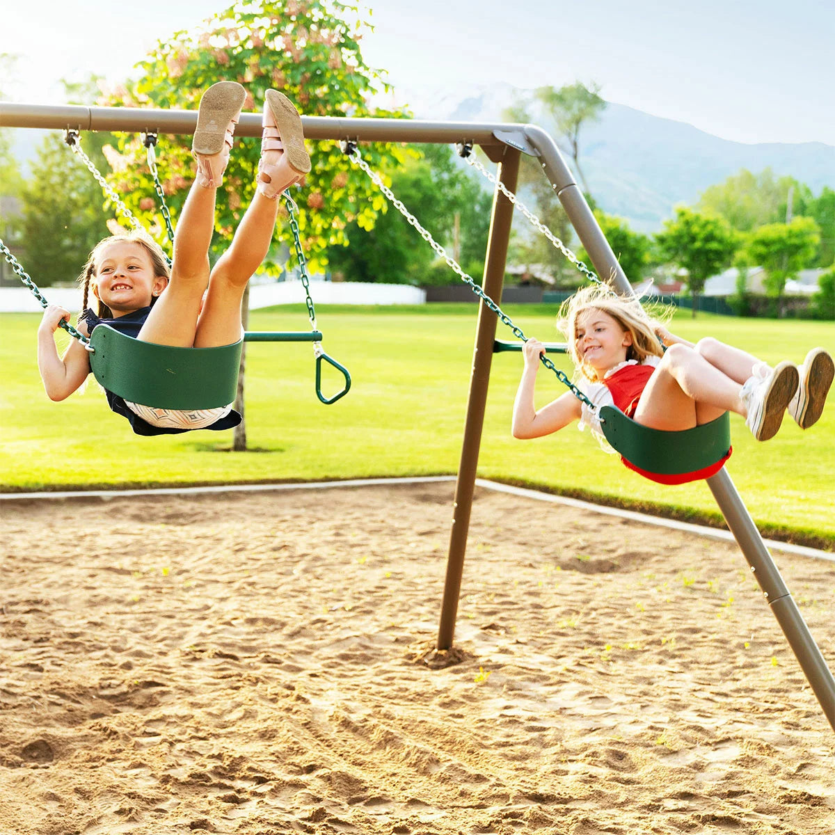 Lifetime 7ft green and tan steel garden swing set featuring two classic swings, a trapeze bar with gym rings, and a durable weather-resistant frame in a family garden-2