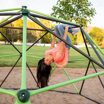 Geometric heavy-duty steel Lifetime climbing dome set up on a green grass garden lawn under sunny skies.