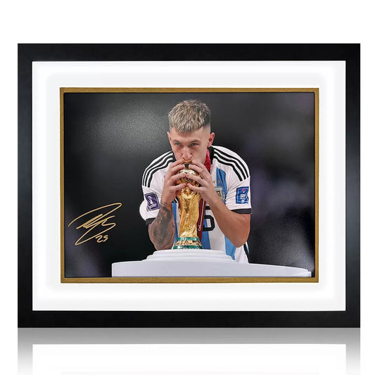 A professionally framed action photograph of Lisandro Martínez in his Argentina national team kit, featuring a bold signature and commemorative metal plaque.