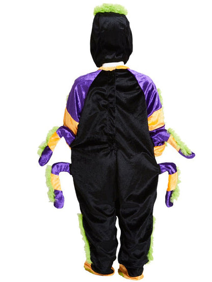Toddler wearing a bright plush Little Spooky Spider costume with soft attached legs outdoors on a trick-or-treat walkway.