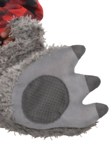 Front view of an infant wearing a fluffy grey wolf costume jumpsuit with an attached red plaid shirt, plush wolf ear hood, and matching grey booties against a neutral backdrop.