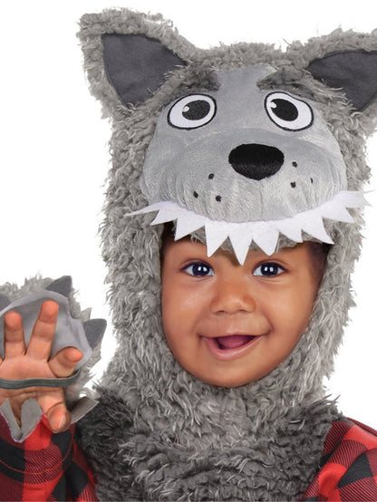 Front view of an infant wearing a fluffy grey wolf costume jumpsuit with an attached red plaid shirt, plush wolf ear hood, and matching grey booties against a neutral backdrop.