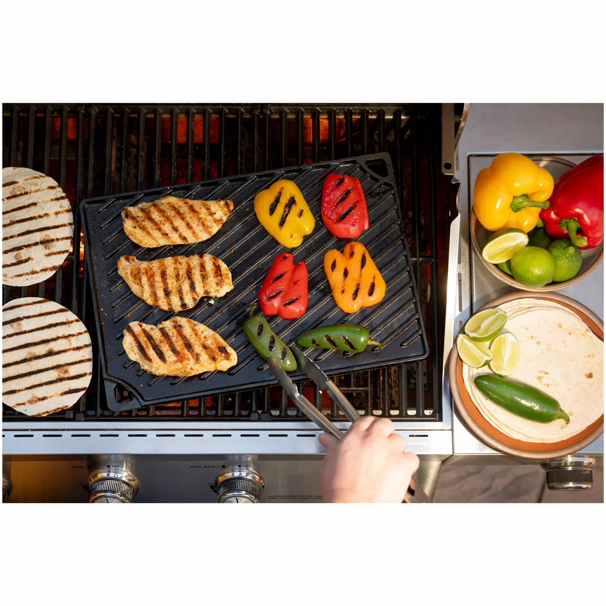 Lodge Seasoned Reversible Cast Iron Grill and Griddle with dual cooking surfaces for grilling, searing, frying, and outdoor cooking.