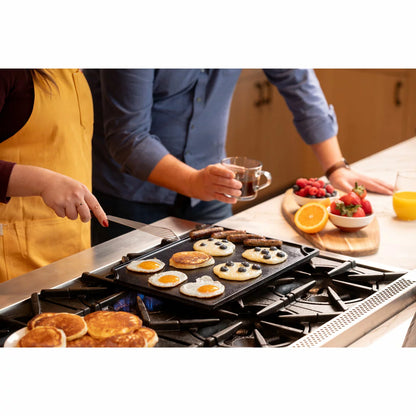 Lodge Seasoned Reversible Cast Iron Grill and Griddle with dual cooking surfaces for grilling, searing, frying, and outdoor cooking.