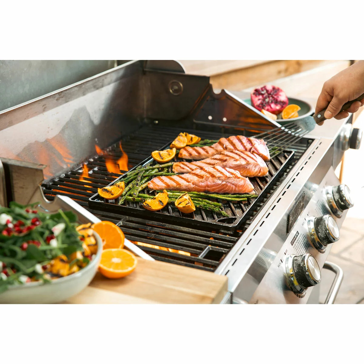 Lodge Seasoned Reversible Cast Iron Grill and Griddle with dual cooking surfaces for grilling, searing, frying, and outdoor cooking.