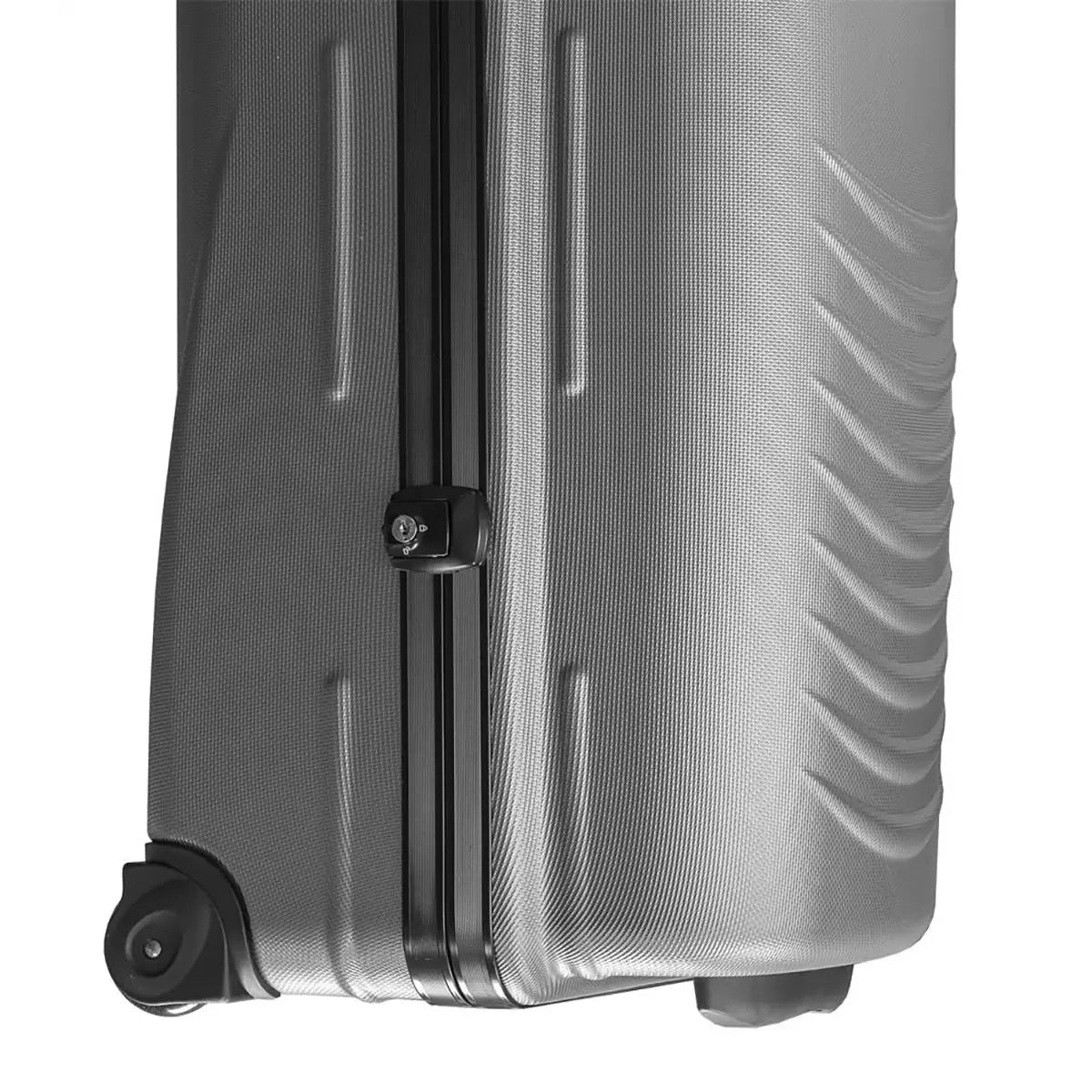 Side angle view of the black Longridge Hard Case Golf Travel Cover standing upright on a smooth terminal floor, showing the rigid ABS plastic shell, integrated roller wheels, and top retractable handle.