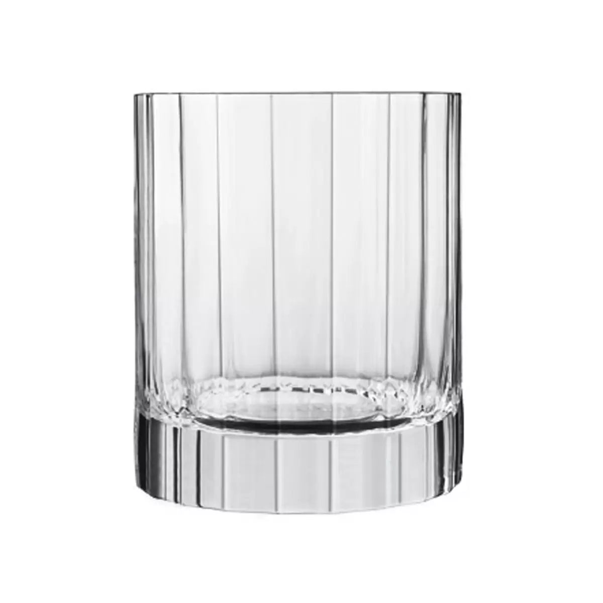 Eight Luigi Bormioli Bach Double Old Fashioned glasses with their signature fluted design, arranged on a home bar, showing their heavy, stable base and crystal clarity.