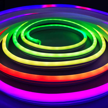 Flexible 5 meter Luminus Smart Wi-Fi Neon Strip Light mounted on a dark bedroom wall displaying colorful segmented RGBIC lighting effects.
