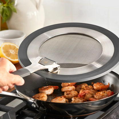MIU 2-piece stainless steel splatter screen set with foldable silicone handles displayed next to frying pans.
