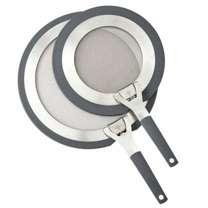 MIU 2-piece stainless steel splatter screen set with foldable silicone handles displayed next to frying pans.