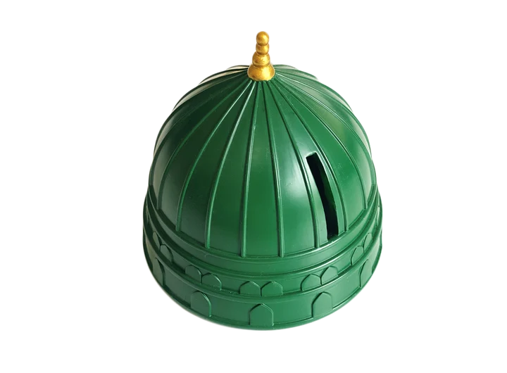 Front view of the hand-painted green dome Masjid Nabawi charity money box with gold minaret details resting on a wooden table.