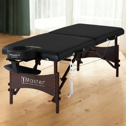 The Master Massage Roma Therma-Top portable table in an upright position, showing the heating control, high-gloss beech wood legs, and included accessories.