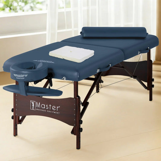The Master Massage Roma II 76cm portable table in a neutral setting, displayed with its included armrest, bolster, and face cradle accessories.