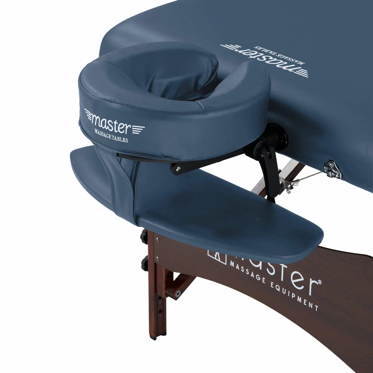 The Master Massage Roma II 76cm portable table in a neutral setting, displayed with its included armrest, bolster, and face cradle accessories.